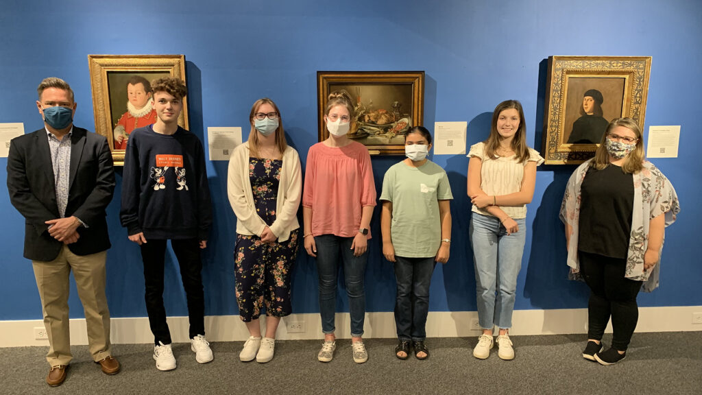2021 high school essay winners stand with museum officials