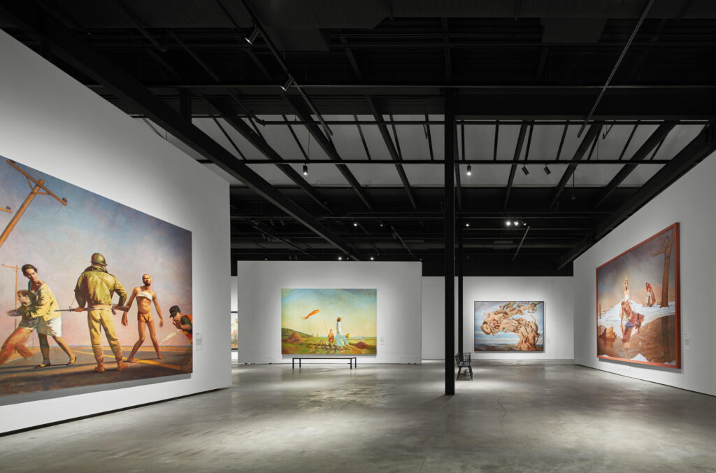 Large paintings on the walls of the main gallery of the Bo Bartlett Center in Columbus, Ga.