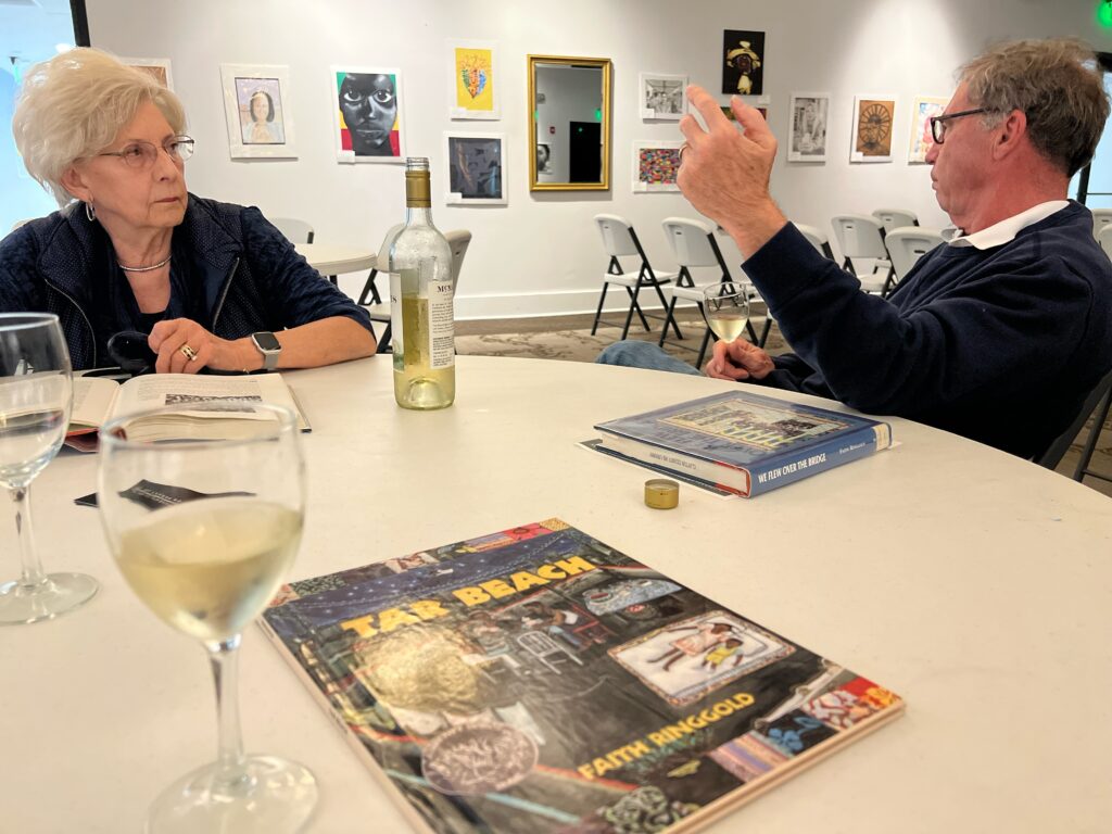 man and woman discuss book at book club meeting