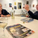 man and woman discuss book at book club meeting