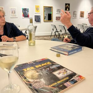 man and woman discuss book at book club meeting