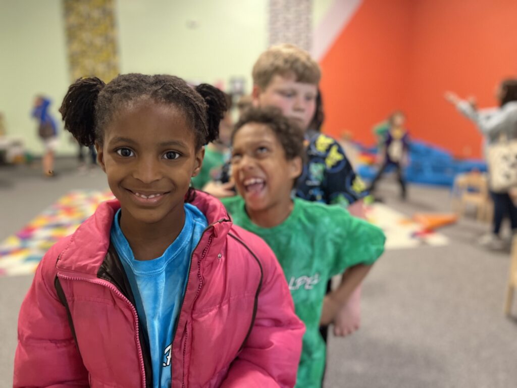 Students smiling during museum tour