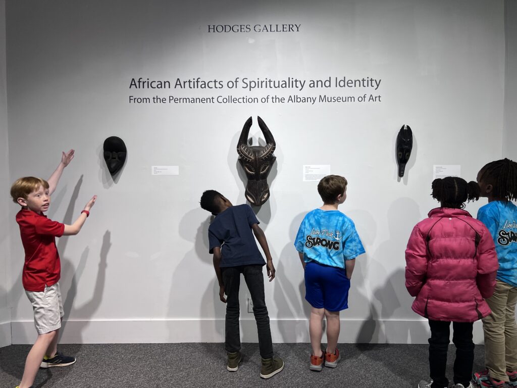 Students look at artworks in the Hodges Gallery