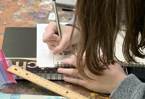Student draws in AMA Classroom