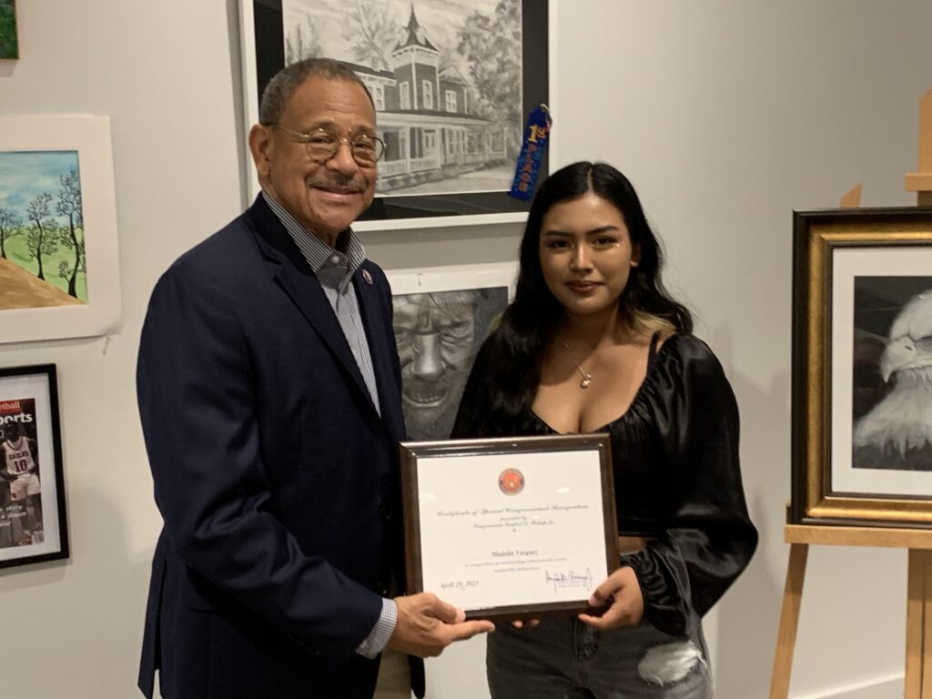 Congressman Sanford Bishop presents third place to Madeline Vasquez in the 2023 Congressional Art Competition