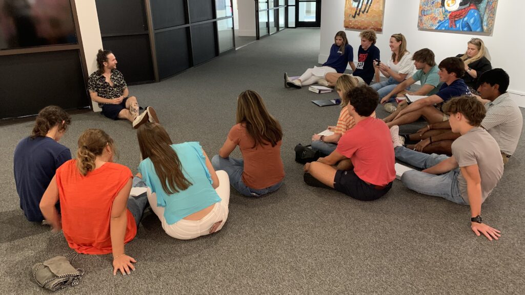 Artist Ramiro Davaro-Comas sits with Deerfield-Windsor AP Spanish students and discusses his work with them in Spanish.