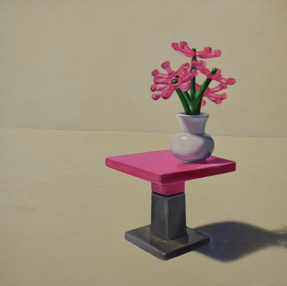 Image of magenta flowers on a pedestal