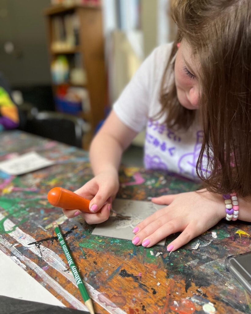 Girl cuts image in AMA classroom