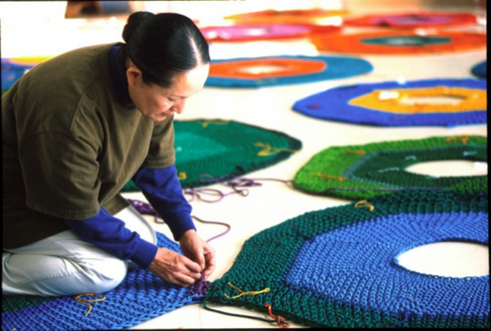 Artist Toshiko Horiuchi creates a colorful art installation by crocheting