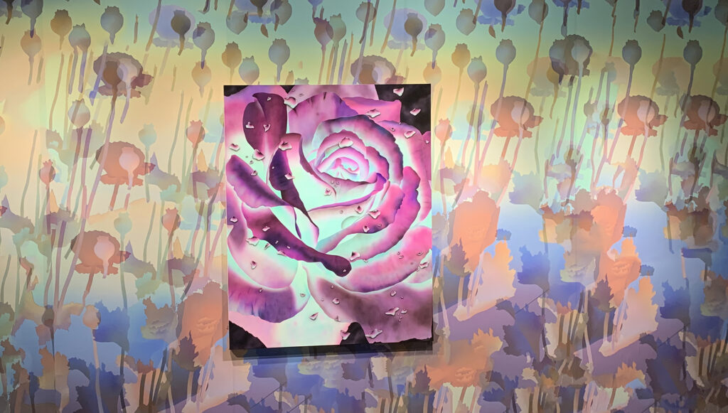 A rose is shown with a flowery background
